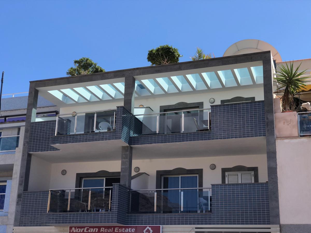 Billy'S Beachfront Apartment With Pool Access ปวยร์โต เด มอแกน ภายนอก รูปภาพ